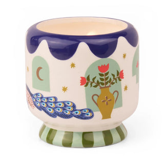 A Dopo Peacock candle detail of hand-painted vessel