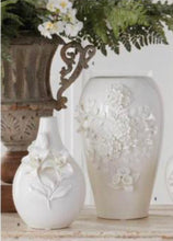 White ceramic bottleneck vase w/ raised lily flowers